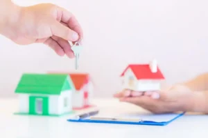 Real estate agent with house model