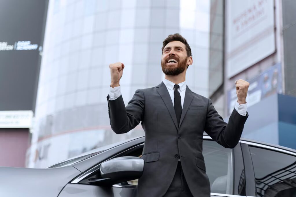 Handsome male standing next to his cab